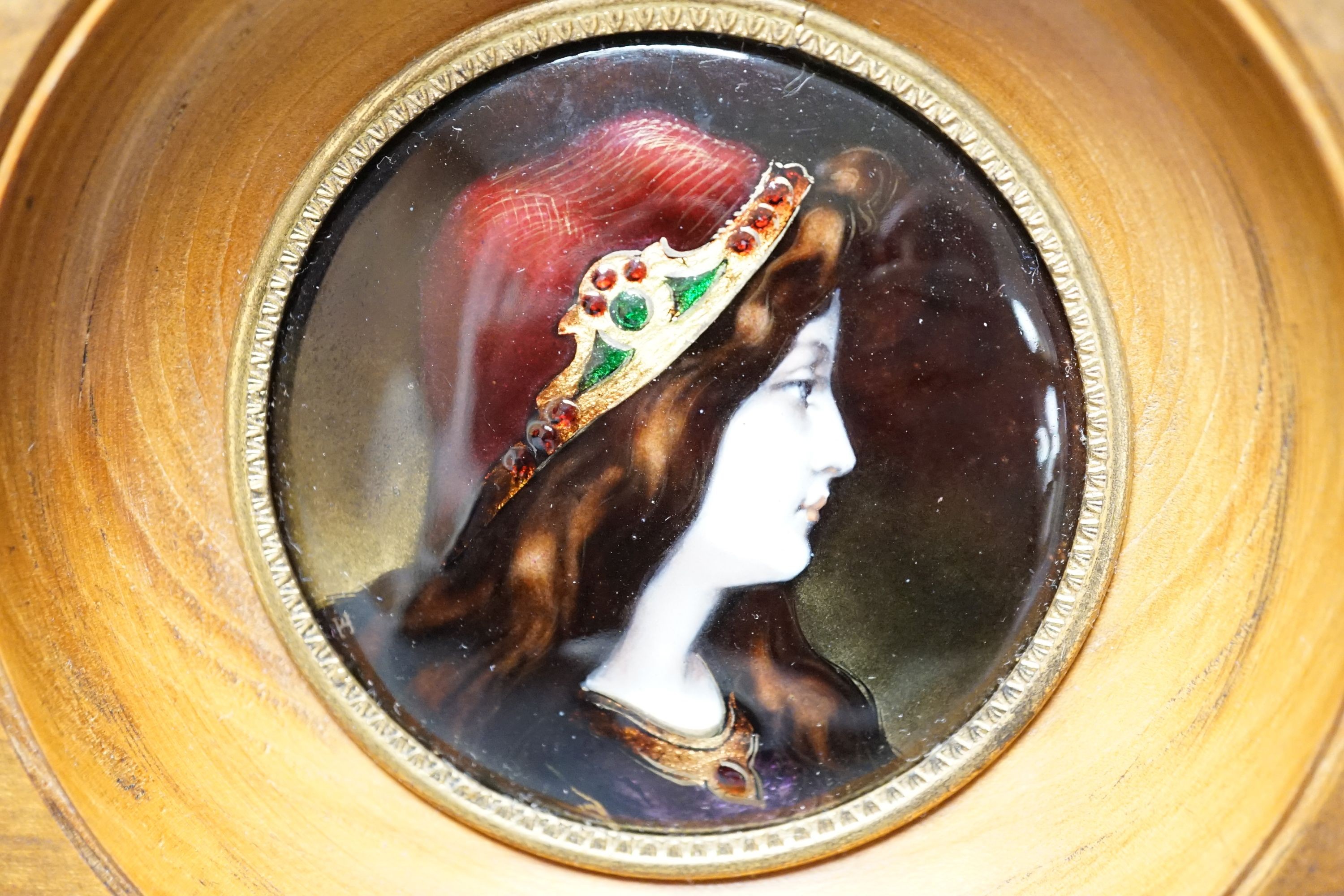 A framed Limoges enamel portrait miniature, 7.5cm diameter